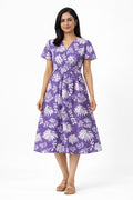 Made in pure cotton, this dress is breathable, soft on the skin, and ideal for all-day comfort. The tropical leaf print paired with a wrap-style bodice and short sleeves gives it a relaxed yet feminine look. Perfect for everyday wear, summer outings, or casual occasions.

Material: Printed cotton
Short sleeves
Sleeve length: 5"
Dress length: 46"