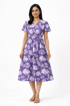 Made in pure cotton, this dress is breathable, soft on the skin, and ideal for all-day comfort. The tropical leaf print paired with a wrap-style bodice and short sleeves gives it a relaxed yet feminine look. Perfect for everyday wear, summer outings, or casual occasions.

Material: Printed cotton
Short sleeves
Sleeve length: 5"
Dress length: 46"
