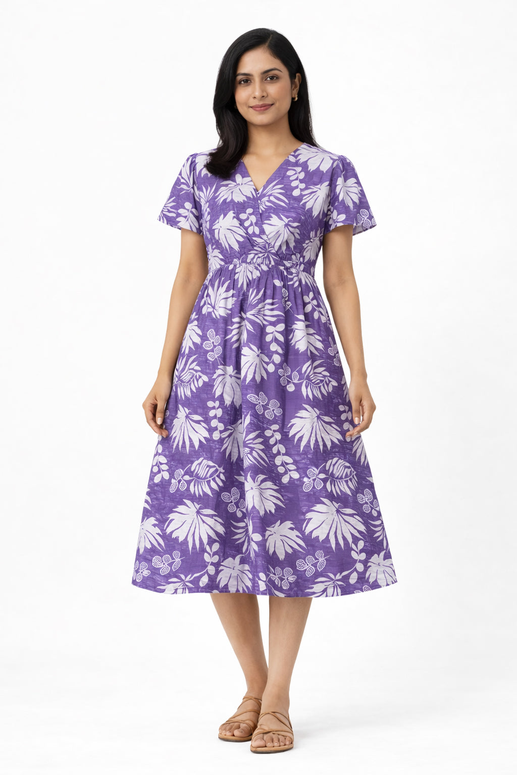 Made in pure cotton, this dress is breathable, soft on the skin, and ideal for all-day comfort. The tropical leaf print paired with a wrap-style bodice and short sleeves gives it a relaxed yet feminine look. Perfect for everyday wear, summer outings, or casual occasions.

Material: Printed cotton
Short sleeves
Sleeve length: 5"
Dress length: 46"